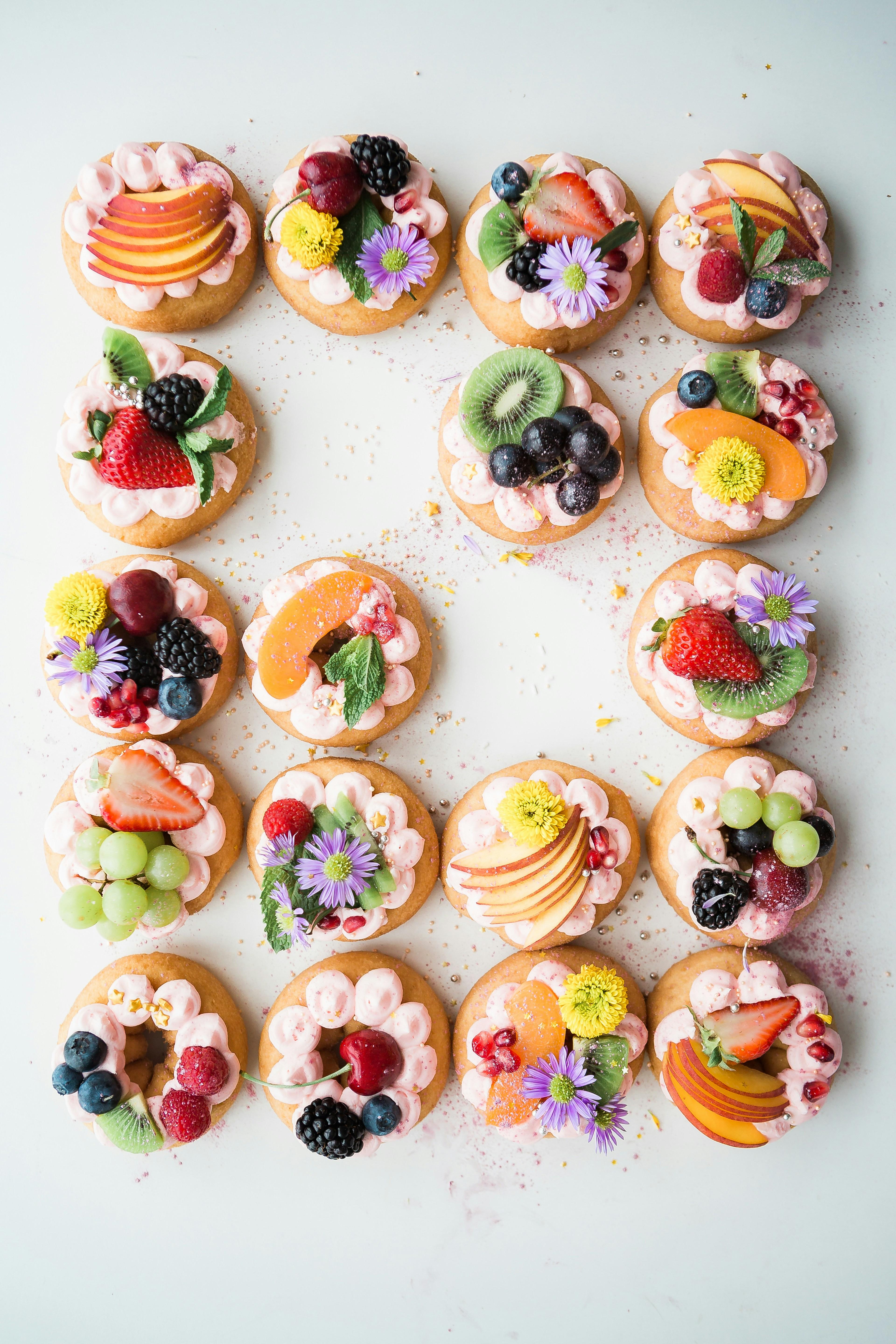 A cluster of freshly frosted cupcakes